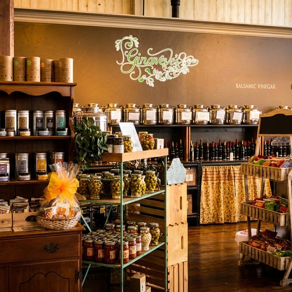 Interior of Ginaveve's, a specialty food store, with shelves of teas, oils, vinegars, and jarred goods.